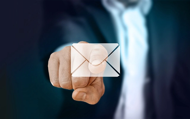 Finger pointing to an envelope